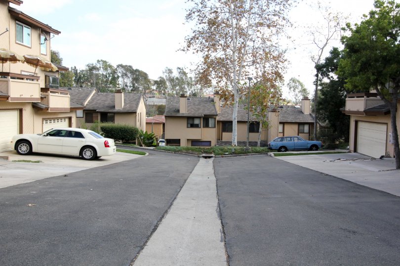Front view of the compound with cars parked in front of the building in Woodlands Ivy
