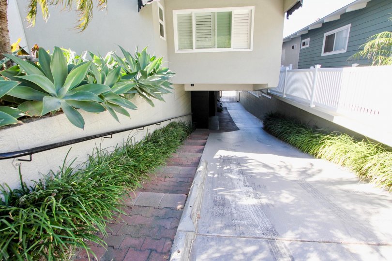A sunny day in the area of Carmel Cove, outside, walkway, railing, stairs, grassck
