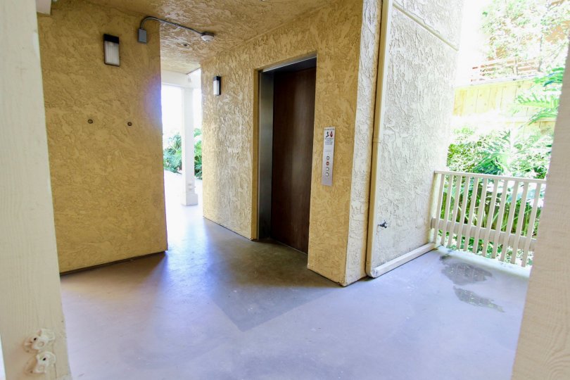A beautiful yellow and wight color lift rest room in the Gresham La Palma near the balcony side.