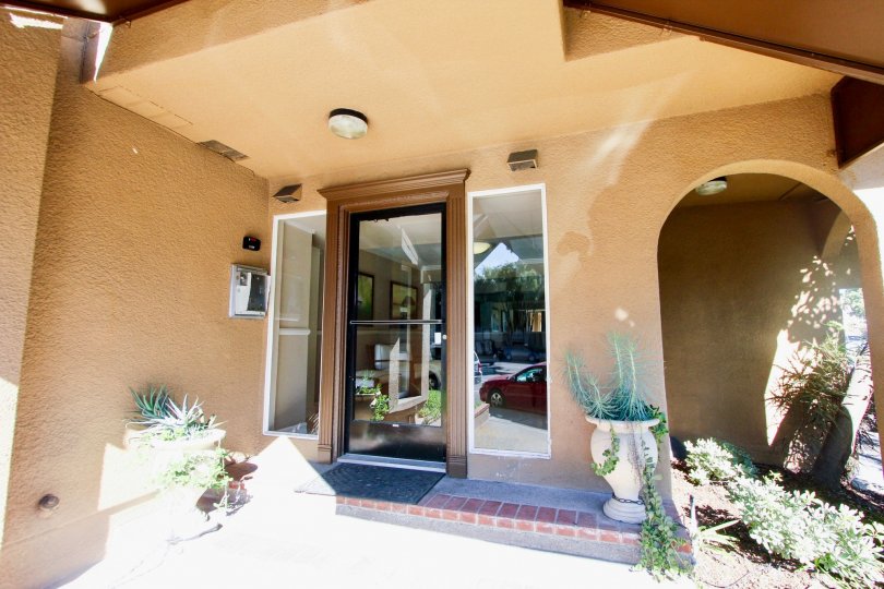 Sunny day of front entrance with intercom to La Jolla Bella, Pacific Beach, California