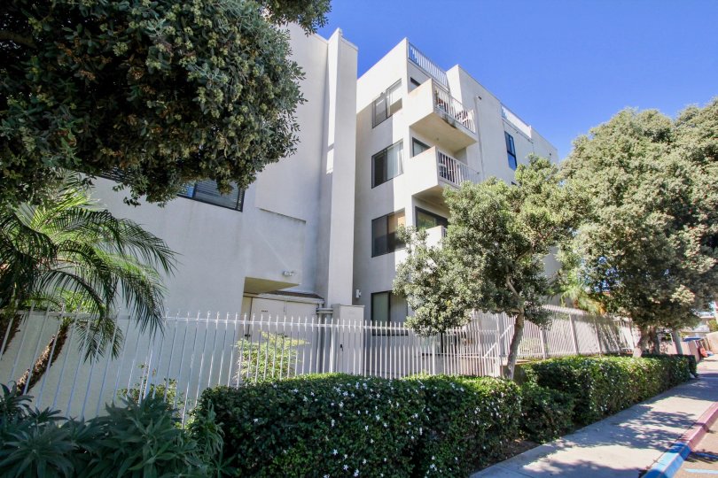 Gated sidewalk view showing the rear of San Remo, Pacific Beach, California