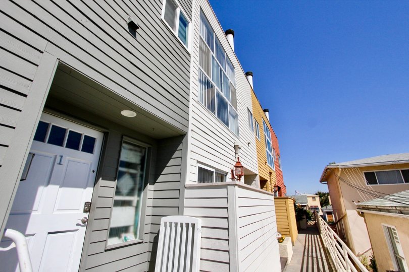 A doorway to an apartment in Harbor View Townhomes in Point Loma, Ca on a sunny day.