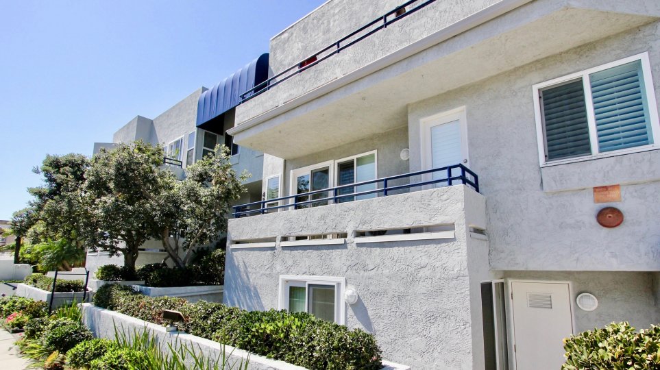A sunny day in the area of Vista La Playa, outside, trees, bushes, balcony, window, door