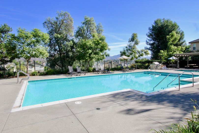 Swimming pool and chairs at Cypress Greensin Racho Bernardo CA