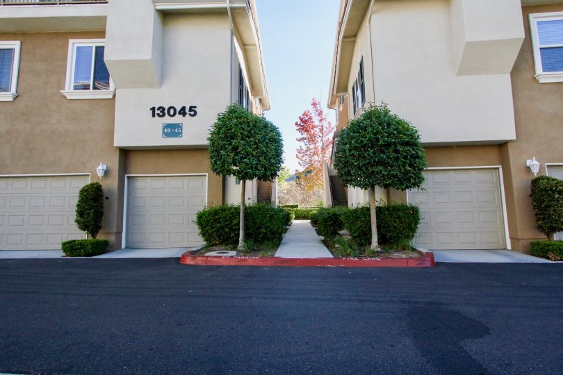 The villa's in Heritage Villas, One has marked by number 13045 with bushes and plants