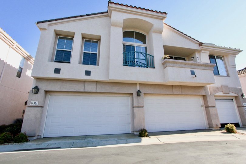 Mira Lago, City: Rancho Bernardo, backside of a building and two car sheds closed