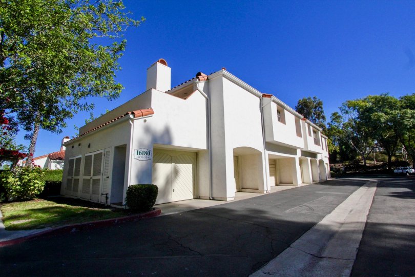 Two story white units with archways inside Palazzo Bernardo in Rancho Bernardo CA