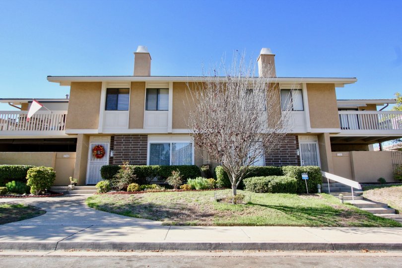 Rental properties in Playmor with a tree in the front yard
