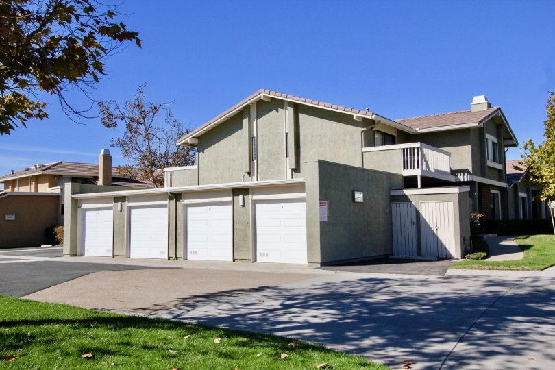 Several garages on a sunny day in Playmor community