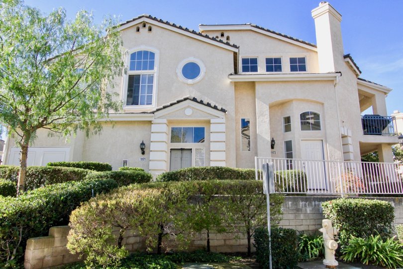 Two story white building with windows & railings at Provencal in Rancho Bernardo California