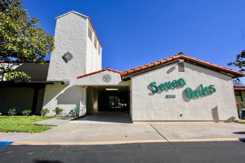Community center with blue sign on the side inside Seven Oaks at Rancho Bernardo CA