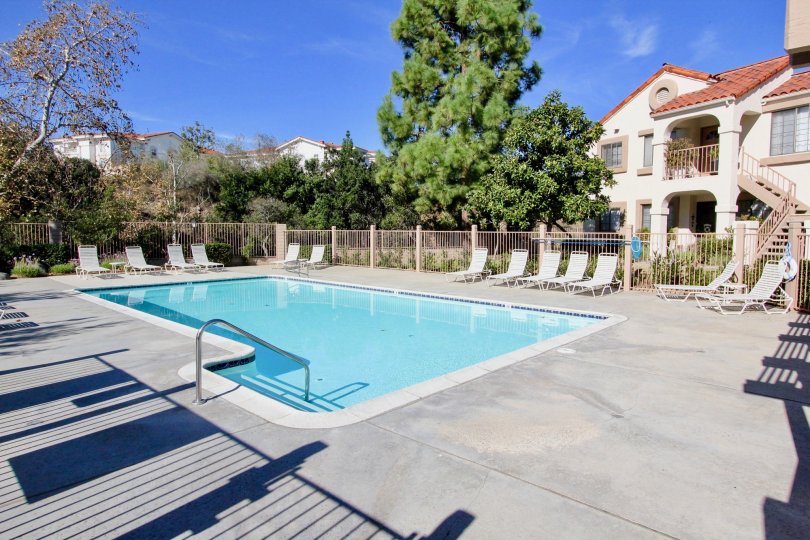 In Stony Brook, villa has swimming pool and chairs for relax