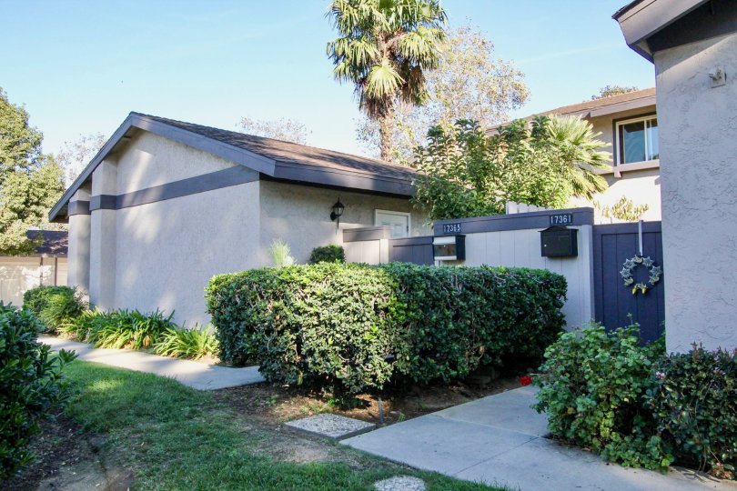 In Westwood Townhomes, Villa has a number 17361 along with bushes