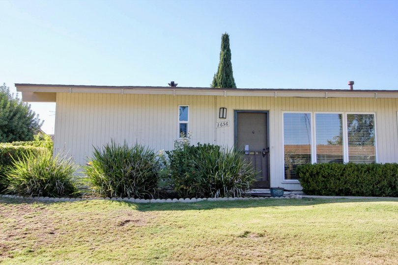 A sunny view of the Lake San Marcos Villas that showcases the amazing gardens located in San Marcos, California
