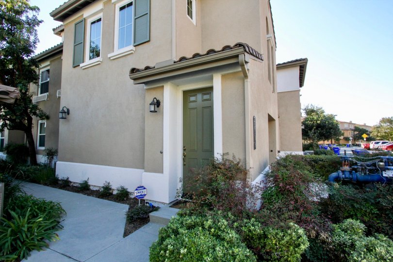 Side view with entry door of Larkspur Heights community in San Marcos, CA
