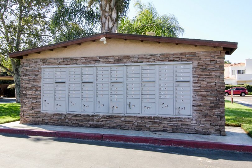 Huge mailbox structure with silver mail boxes in Westlake Ranch at San Marcos CA