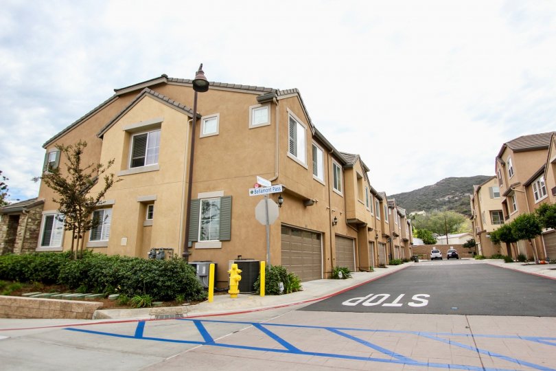 A street way corner with mountain in background in Aubrey Glen