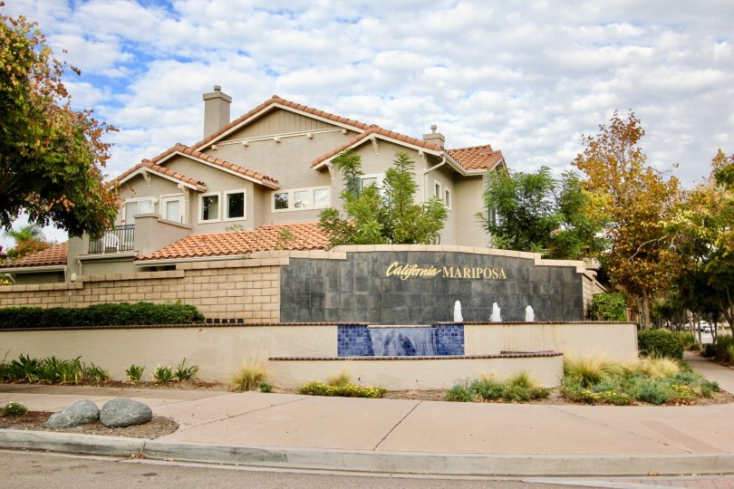 Modern structured building with several fountains and a waterfall.