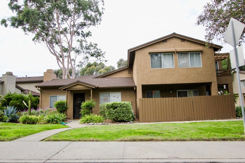 A brown 2-story residental house in the Highland Trails Community. Santee, California.