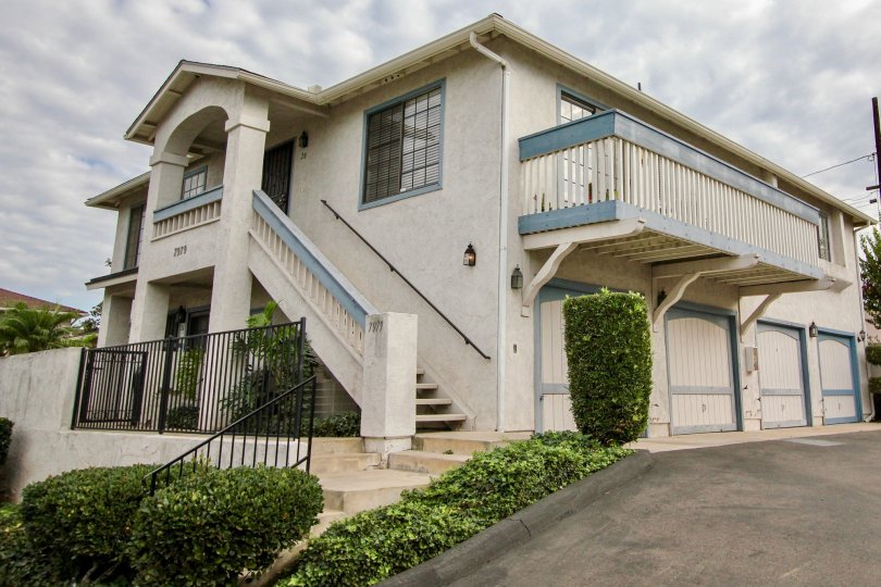A sunny day in the area of Mission Martinique, stairs, tree, balcony, outside, bushes, garage