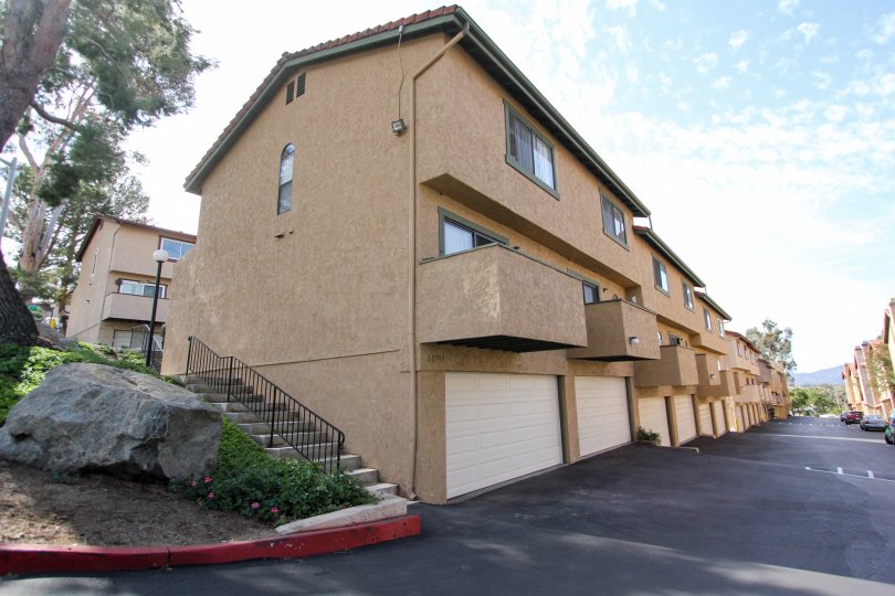 Private balconies and tuck-under garages at Riderwood Terrace in Santee, California.