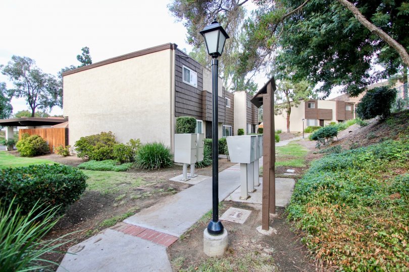 Mail boxes located next to the Rio Terrace homes along a paved path.