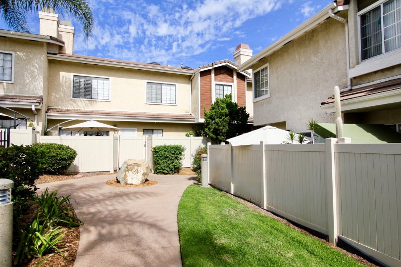 Palm trees and blue skies at the Lakes with private fenced patios in Santee, California