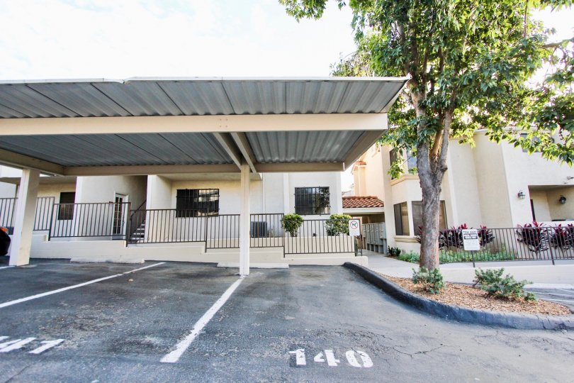 A sunny day in the area of Towne Villas, parking area,