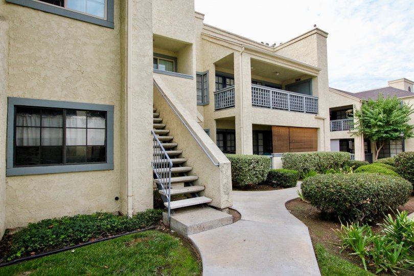 Some Stairs and a Hedgerow outside a block of apartments at Vista Del Rio in Santee California