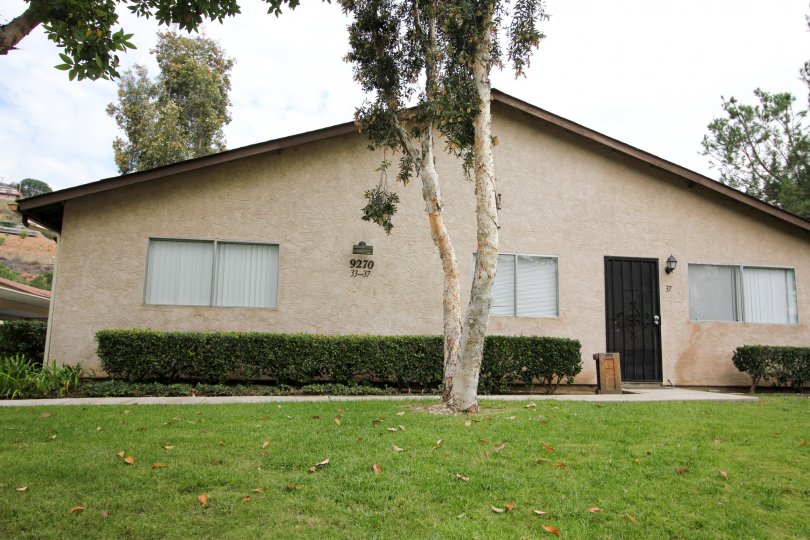 Front entrace view with tree of Hidden Valley community, Spring Valley, CA