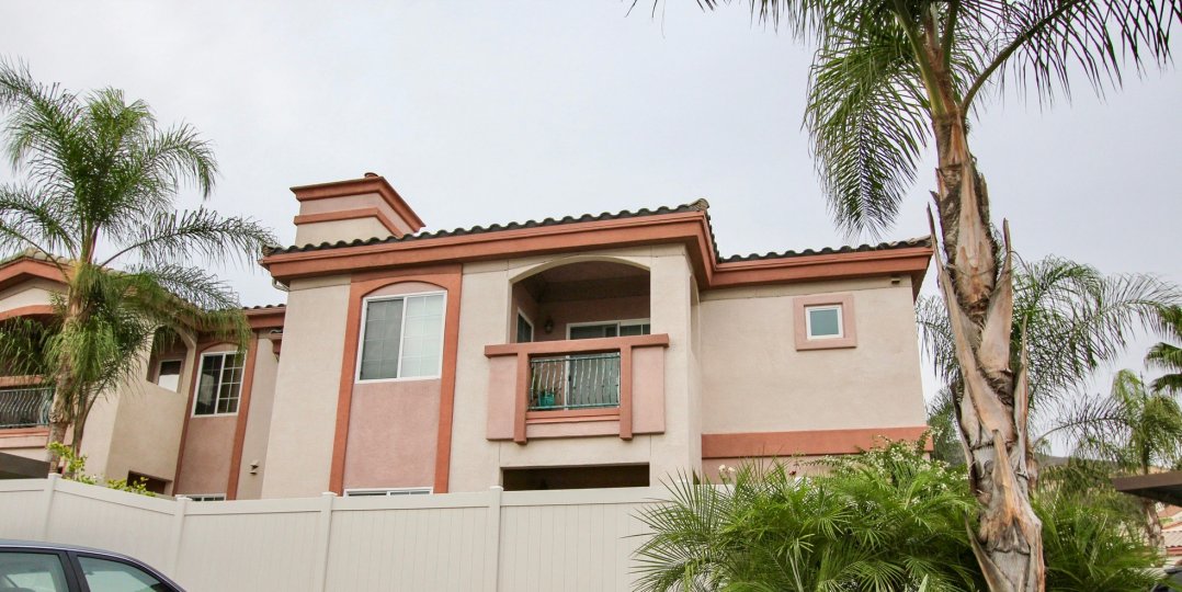 A two-storey residence with orange trimmings in Pointe Lakeview neighborhood.