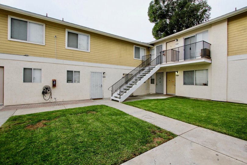 Exterior view of grassy outdoor area of Sandstone Community apartments in Spring Valley, California