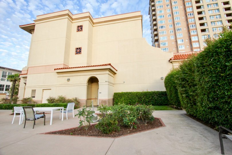A view of the outside terrace at the Pacific Regent La Jolla showing seating and landscaping.