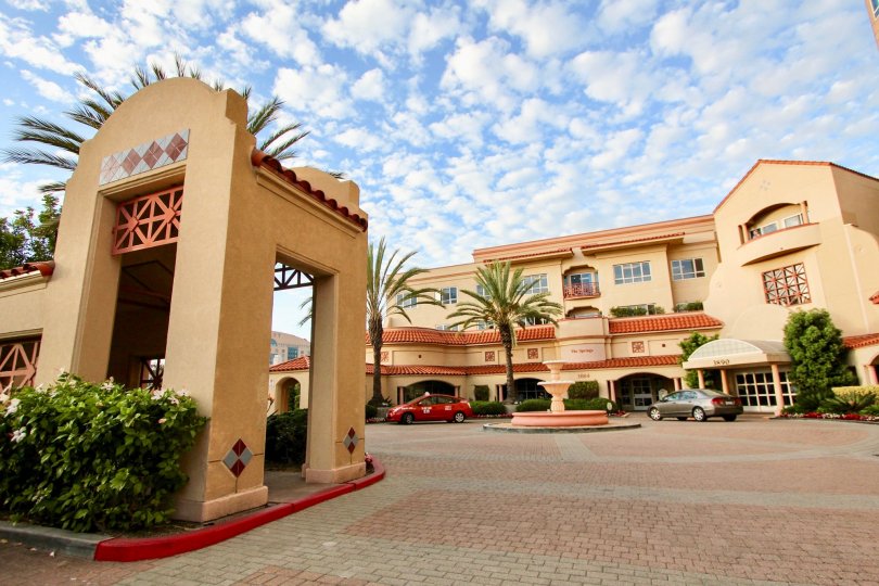 Housing complex with driveway and fountain at Pacific Regent La Jolla in University City California