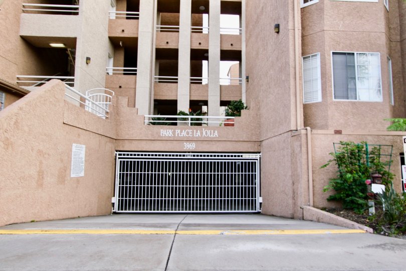 Front parking entrance of the building have white Gate in Park Place La Jolla