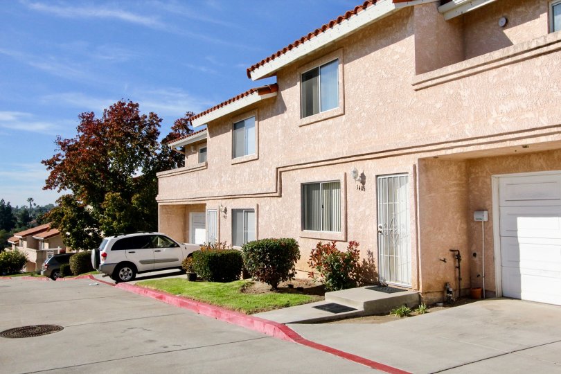 Front of two houses with main door, garage door and two floors in the Hillview Townhomes