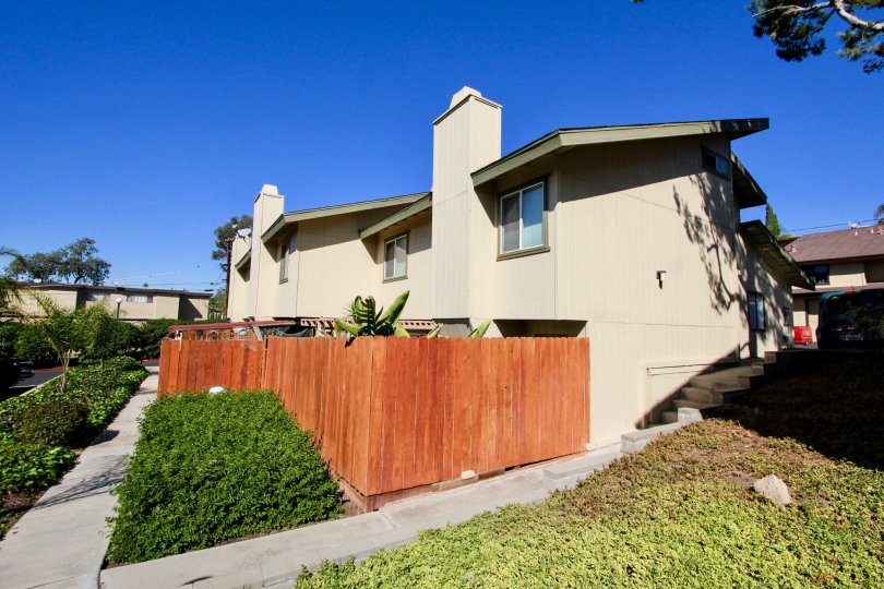 Sunny backyard sidewalk of he Marlin Terrace complex in Vista, California