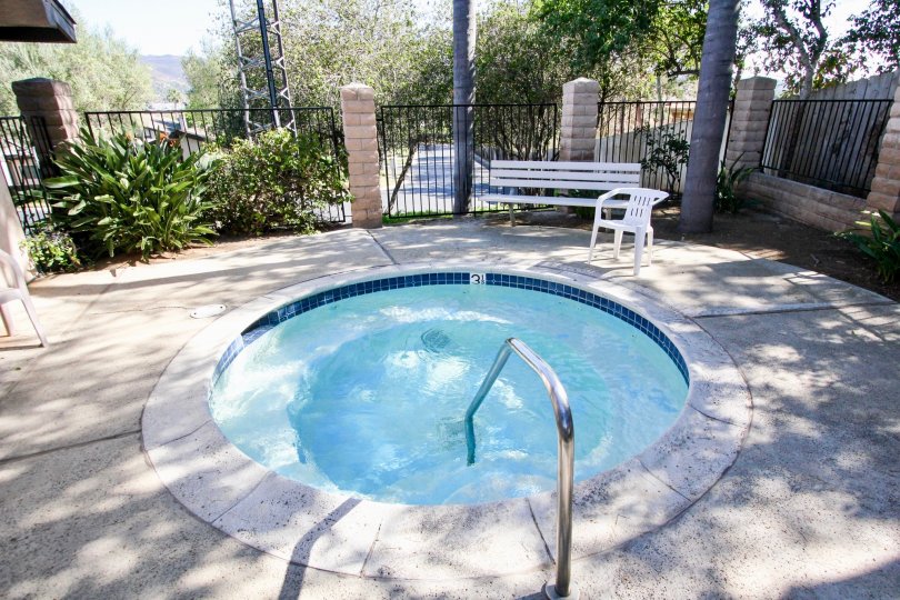 Hot tub surrounded by iron fence at Nob Hill in Vista California