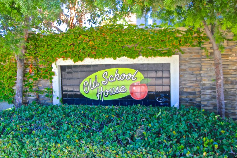 Old School House Marquee has a black background and a picture of an apple