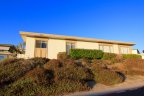 This single family home resides on a corner lot of the Oceana Community.