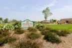 The sign for John Magee Park at Veranda
