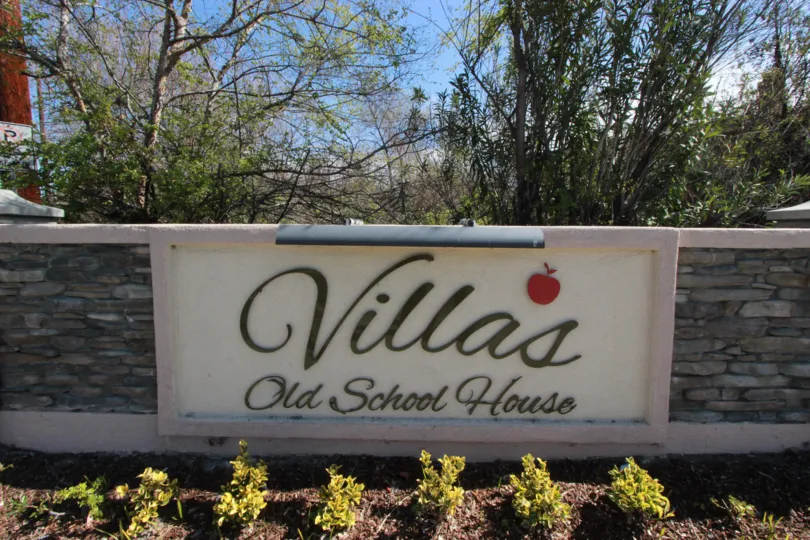 Old School House Marquee has a black background and a picture of an apple
