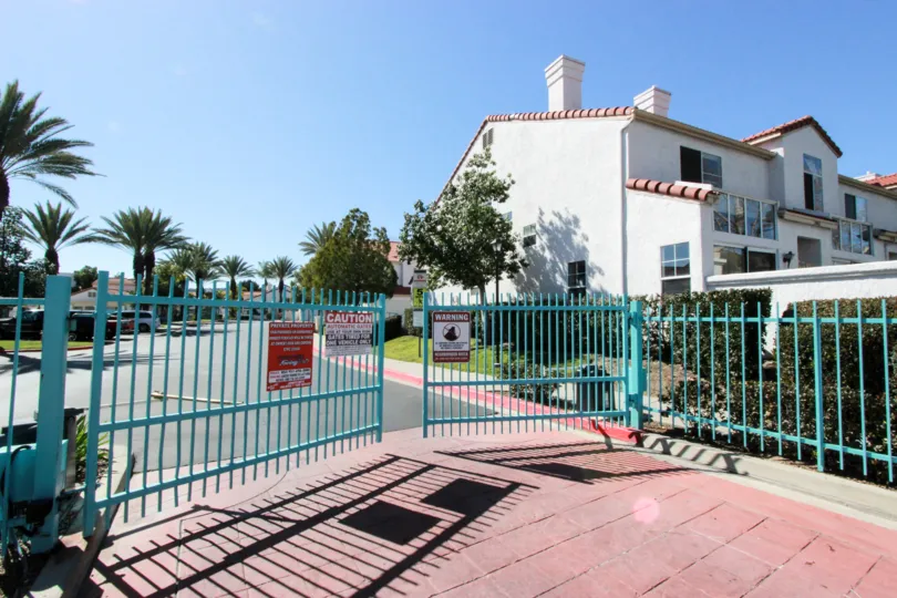 A pathway in front of a row of Townhomes at Rancho Del Mar