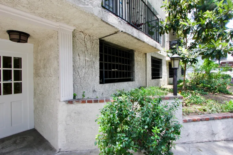 Stone building with greenery at 317 S Holt Beverly Center, California