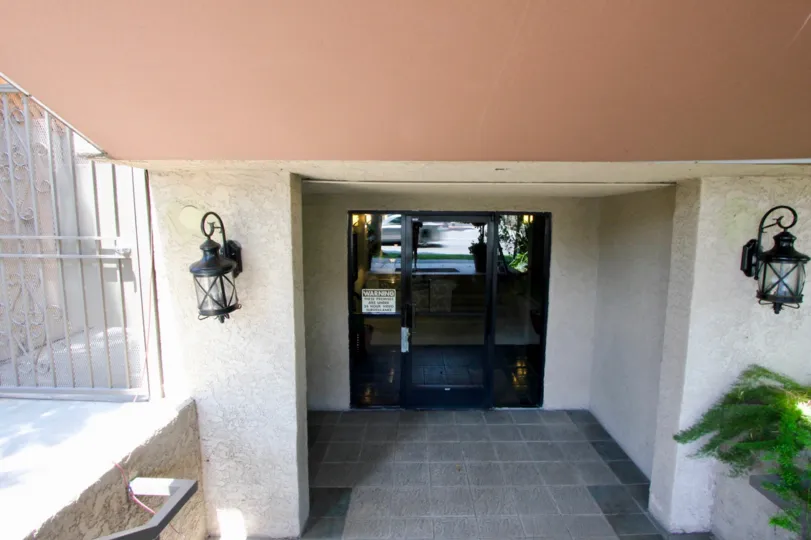 Building entrance with warning sign in 8651 Olympic, Beverly Center, California