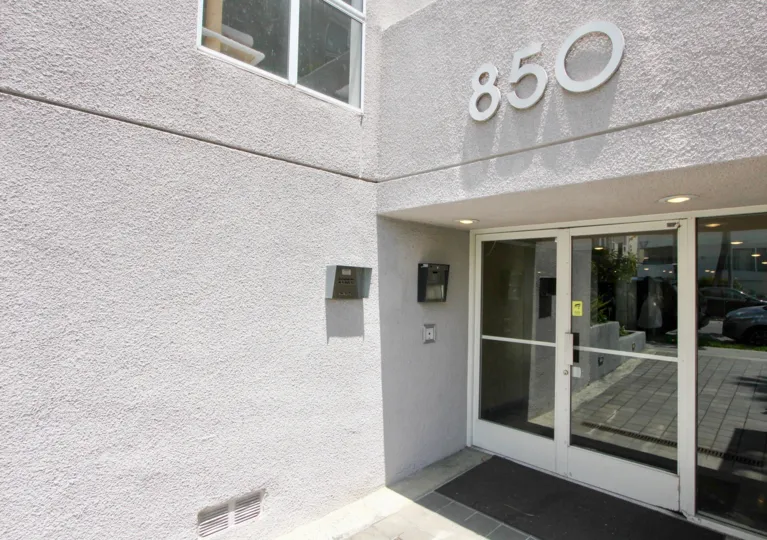 Front entrance at Beverly Shenandoah with large class doors and call box.
