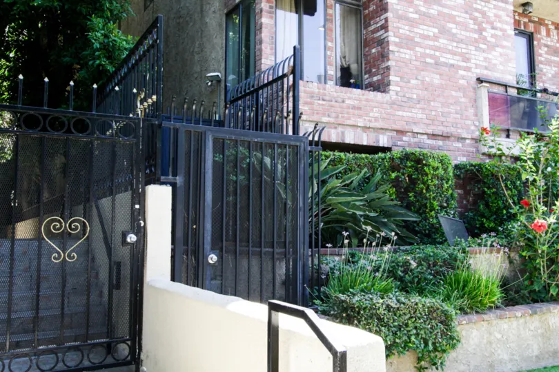 The gated secondary entrance into the Doheny Square