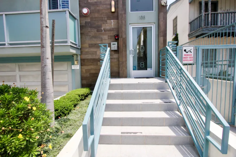 Front entrance to a commercial building on a sunny day.