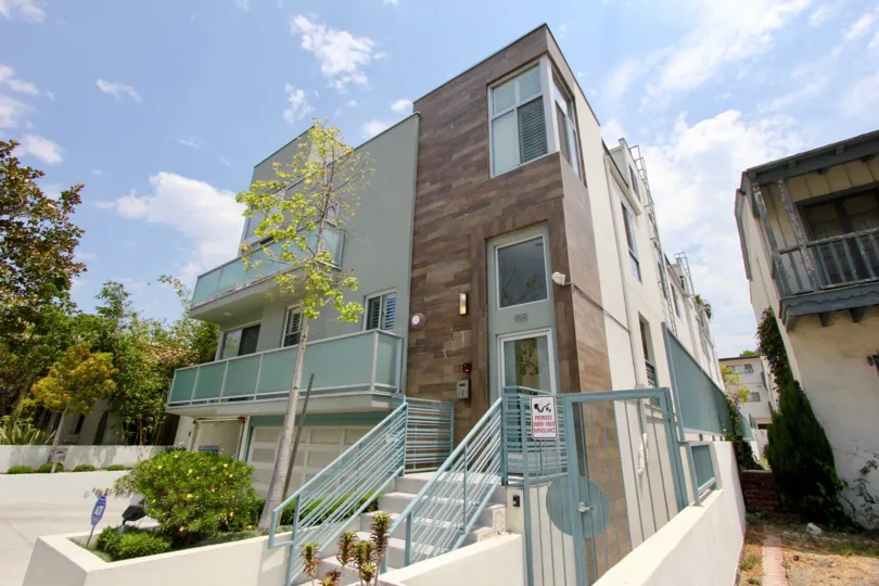A sunny day at Apartment One-O-Eight Croft with trees and parking garage