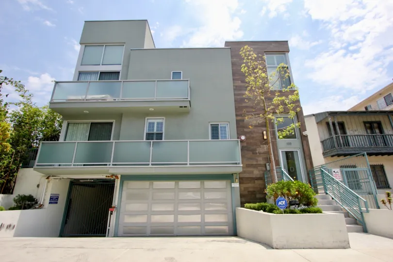 Modern, sleek single family home with garage protected by nation's leading security company